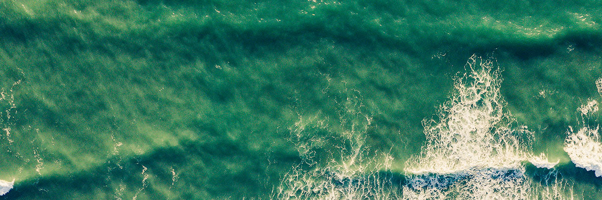 overhead shot of waves on the beach