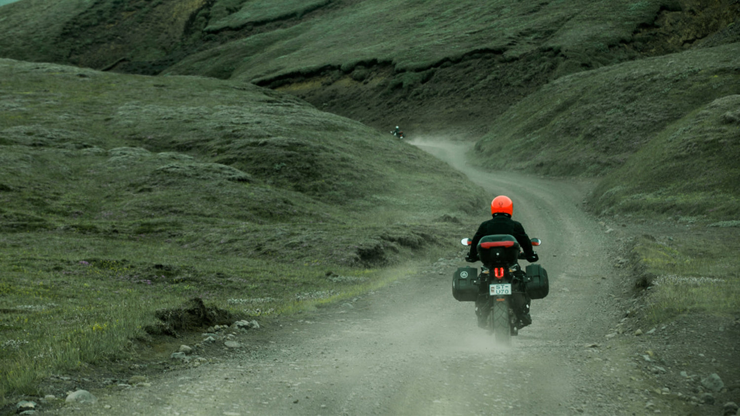 person on motorcycle riding in the hills